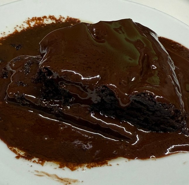 A slice from the Matilda cake after its been in the microwave and the ganache has melted