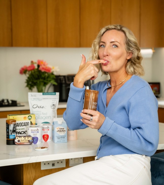 Bethany Eaton eating chocolate nut butter from a jar