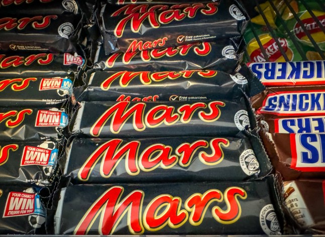 BATH, UNITED KINGDOM - OCTOBER 20: Mars bars are displayed for sale in a shop, on October 20, 2024 in Bath, England. Mars Wrigley, which makes the likes of Mars bars, Snickers, M&M???s, Celebrations, Maltesers, Galaxy and Skittles, has paid out a huge ??600m dividend after a bumper financial year. (Photo by Matt Cardy/Getty Images)
