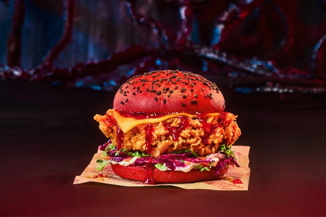 The new red Stranger Things Burger from KFC on a dark background